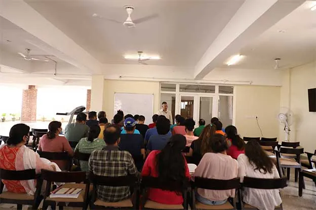 Patients and counsellors together in a group meeting at the Gurugram centre