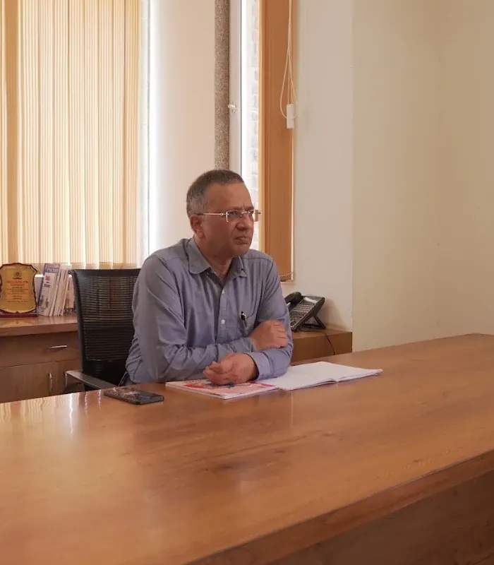 Dr. Gorav Gupta at his desk in the New Delhi consulting room